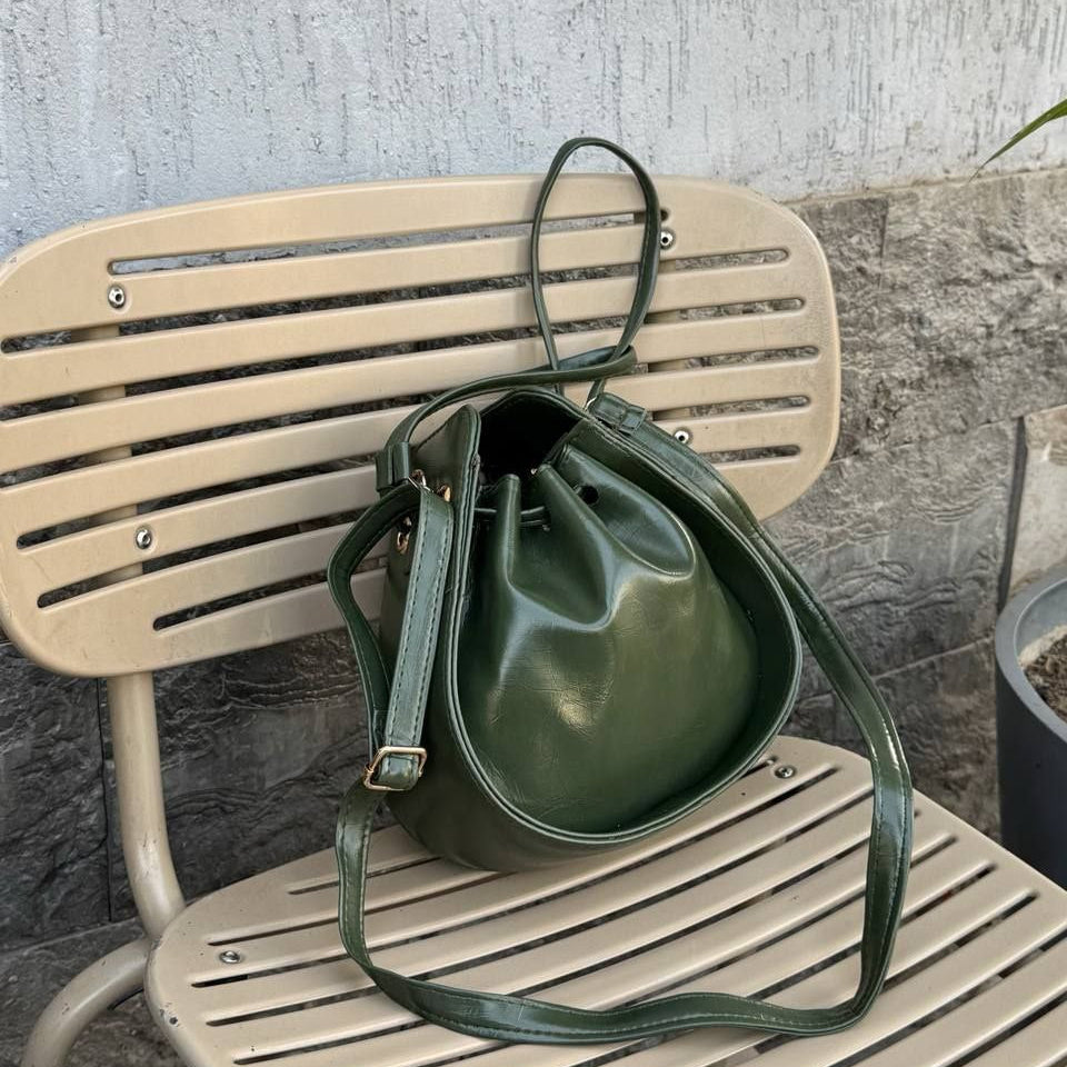 Forest green olive leather bucket bag with adjustable strap