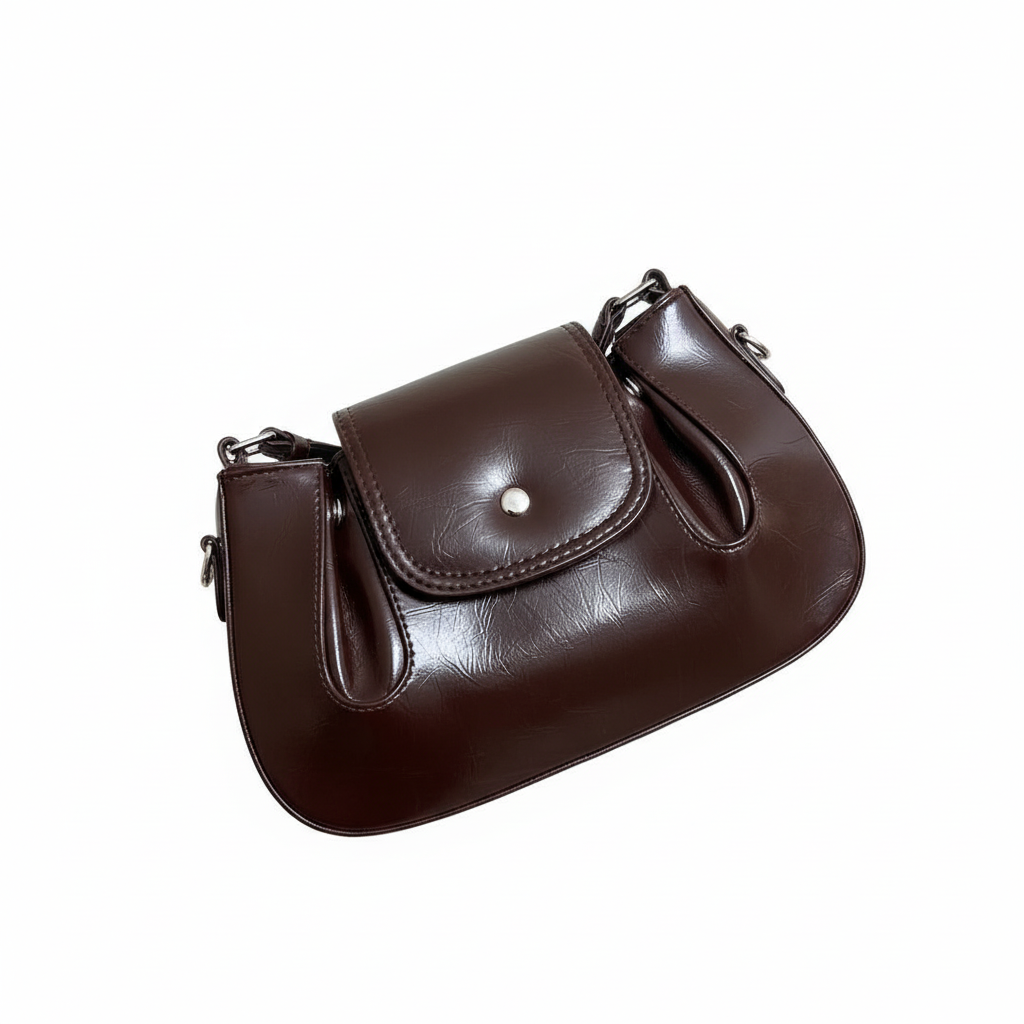 Brown leather handbag on white background