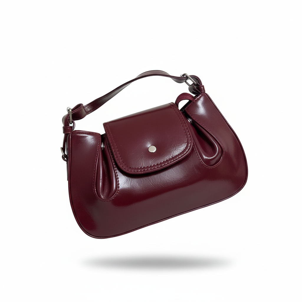 Burgundy leather handbag on white background